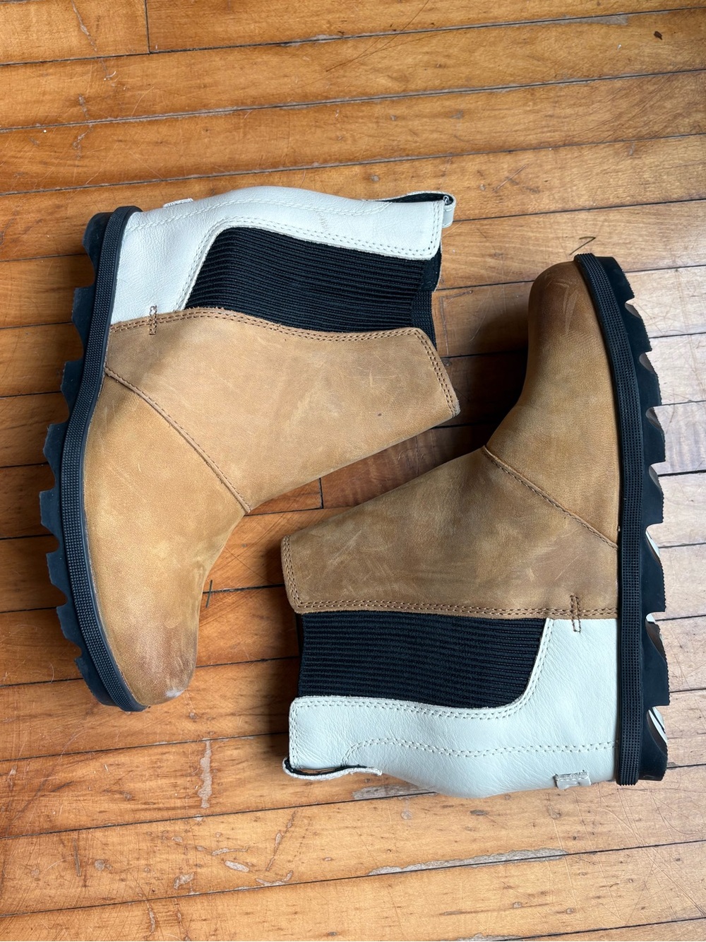 Sorel Joan of Arctic Wedge II Chelsea boots in a tan and black colorway